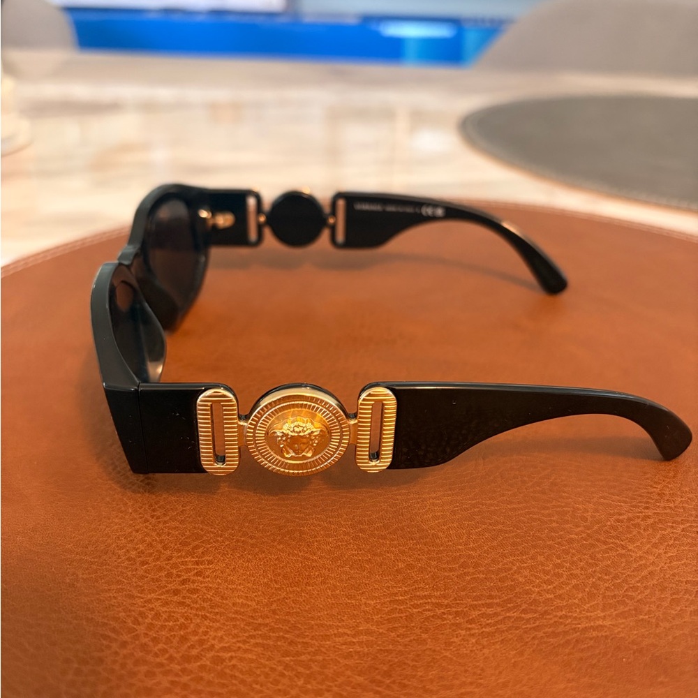 Versace Sunglasses with Black Frame and Gold Medallion